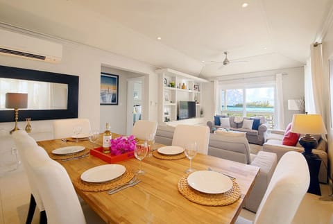 Open-plan living and dining room, overlooking Laughing Bird Cay