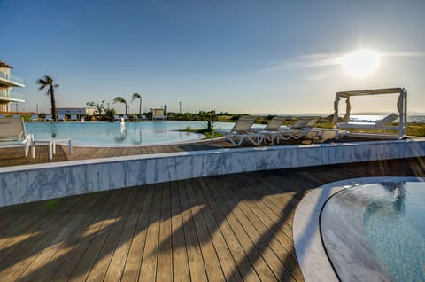 Indoor pool, outdoor pool, pool umbrellas, sun loungers