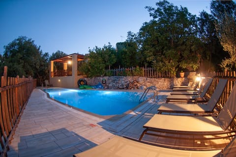 pool in the night overlooked form tour pergola with amazing views