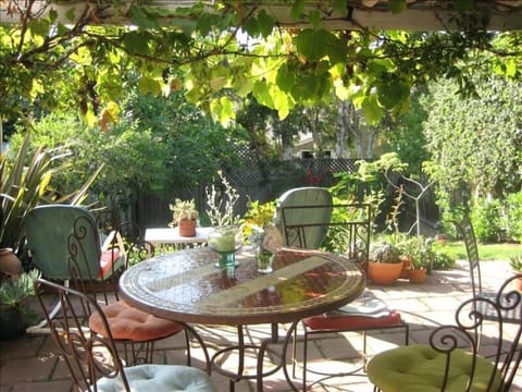 Enjoy a barbeque on the patio overlooking the lush garden