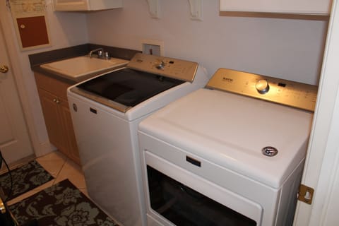  Washer and Dryer in a nice laundry room....storage for Beach Towels