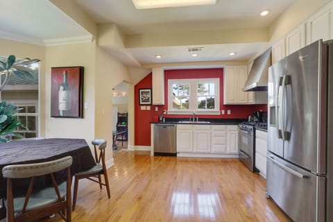 kitchen and informal dining area w/view into gameroom