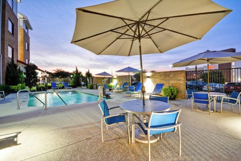 Outdoor pool, open 8 AM to 10 PM, pool umbrellas