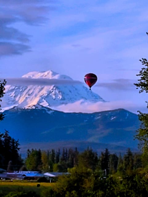 Early Morning Balloon over Enumclaw Plateau, Mt Rainier in the background. 
