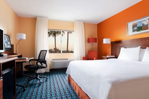 Premium bedding, desk, laptop workspace, blackout drapes