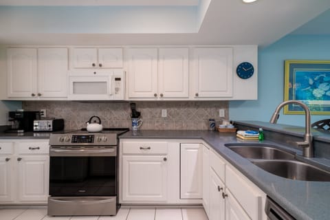 The kitchen has stainless steel appliances