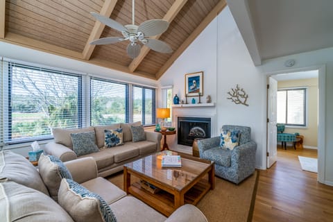 Hardwood floors and comfortable furnishings invite you to relax in the Great Room