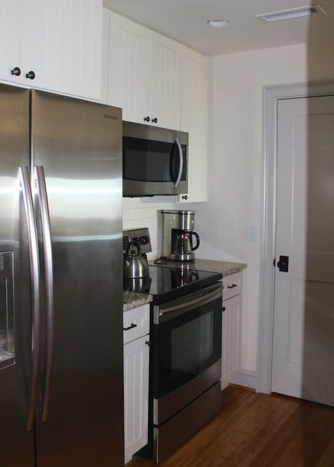 The stainless appliances are topline. The stacked washer/dryer is in the closet.