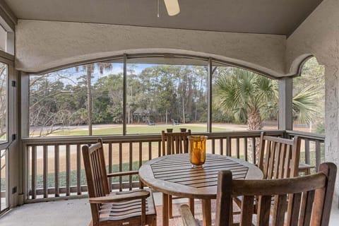 The screen porch off the living room has a table for dining