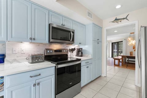 Stainless steel appliances and fully stocked kitchen