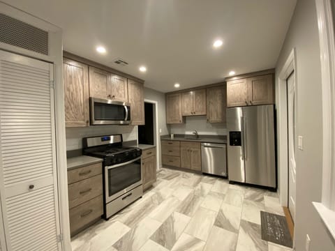 All NEW kitchen, SS appliances, custom cabinets, Silestone counters! and more!