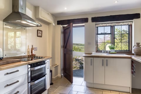 Kitchen with door out to those magnificent views