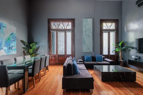 Here is a photo of our spacious open living/dining room with our classic windows