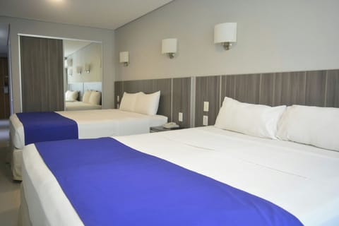 Premium bedding, down comforters, in-room safe, desk