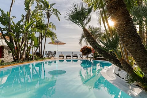 Outdoor pool, a heated pool, pool umbrellas, sun loungers