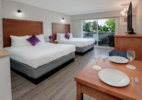 Room, 2 Queen Beds, Kitchenette (Coast) | Premium bedding, Select Comfort beds, individually furnished, desk