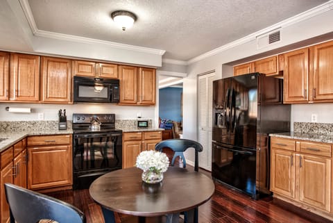 The kitchen provides quick and easy access to the dining room.