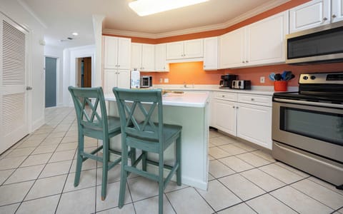 Stylish kitchen and breakfast island, perfect for brewing your morning coffee and sharing great conversation at the bar
