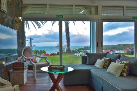 Deluxe Villa, Multiple Beds, Accessible | Living area | Flat-screen TV