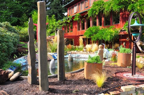 The windows of the flat look out on this pond