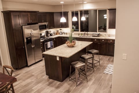 Stay in or go out! Stocked gourmet kitchen; large gathering island