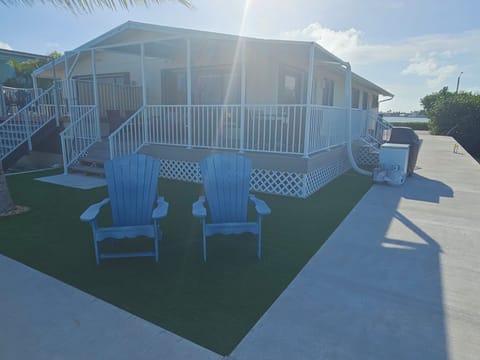 Amazing backyard and deck to enjoy a lazy day in the keys under a palm tree.