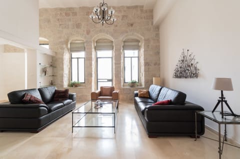 Deluxe Duplex, 2 Bedrooms | Living room | Flat-screen TV