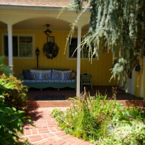 Use the door on the right of the porch
