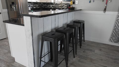 Tile floors throughout.  Bedrooms only carpet.