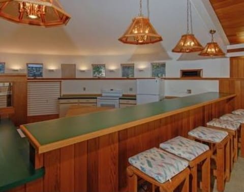 Pool area full kitchen with seating & music system!