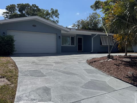 Front. Driveway is pitched uphill.