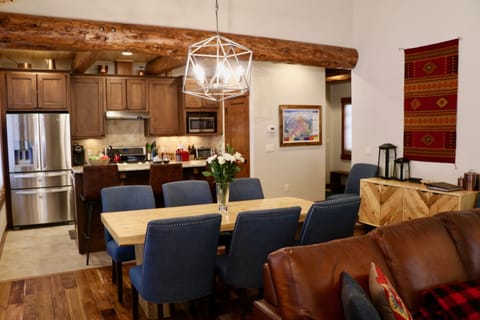 Dining room table with 8 chairs (6 in photo - 2 off to sides) + 3 bar stools.