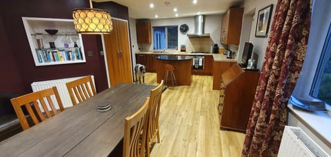 Open plan kitchen, looking from dining area