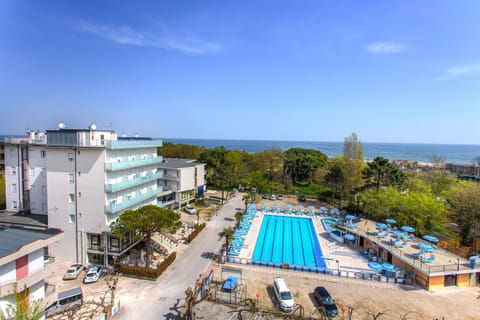 Outdoor pool, open 9:00 AM to 6:30 PM, pool umbrellas