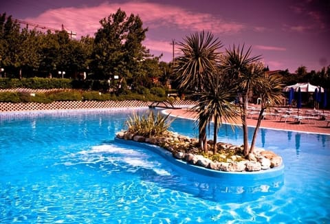 Seasonal outdoor pool, open 9 AM to 7 PM, pool umbrellas, sun loungers