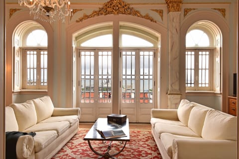 Deluxe Suite, River View | Living area | TV
