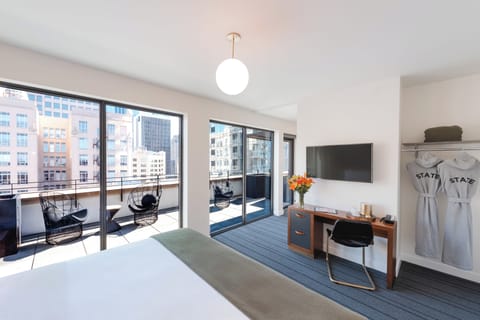 Suite, 1 King Bed, Accessible, Terrace | Desk, blackout drapes, soundproofing, iron/ironing board