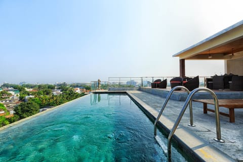 Outdoor pool, open 6 AM to 10:00 PM, pool umbrellas, lifeguards on site