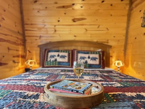Relax in bed with a glass of wine and a good book.