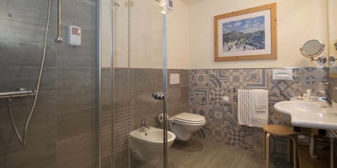 Combined shower/tub, hair dryer, bathrobes, slippers