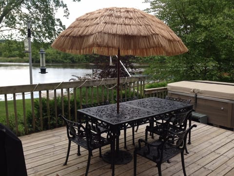 Deck table with umbrella and wonderful view of the water, nature, birds, etc.