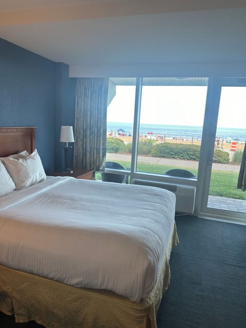 Bedroom with queen bed and flat screen tv