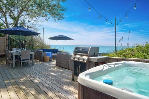 Hot tub, grill, and deck overlooking the Sound