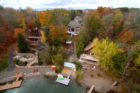 3 decks, a fire pit overlooking the lake, rock beach and private dock
