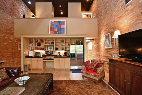 Kitchenette and food prep area within easy reach to  coffee table and nook. 