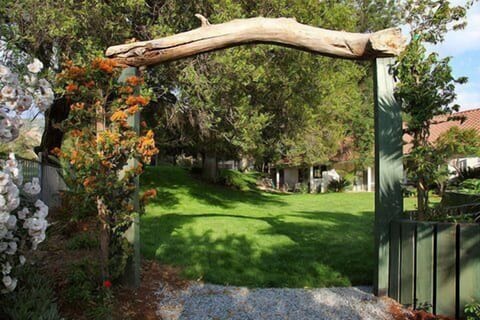 View from rear arch way to River path.