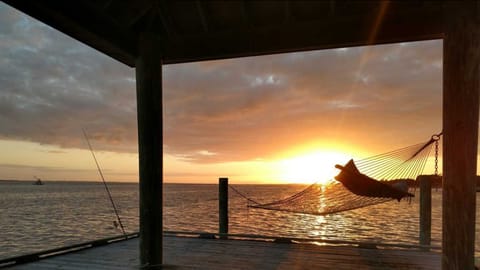The dock faces due south, so you get both sunrises & sunsets over the water!