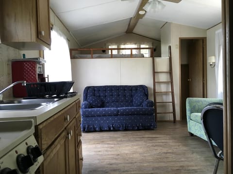 Living room with a loft above