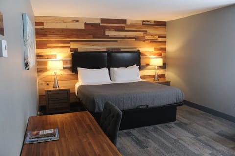 Junior Room, 1 King Bed, Mobility Accessible, Ground Floor | Desk, laptop workspace, blackout drapes, iron/ironing board