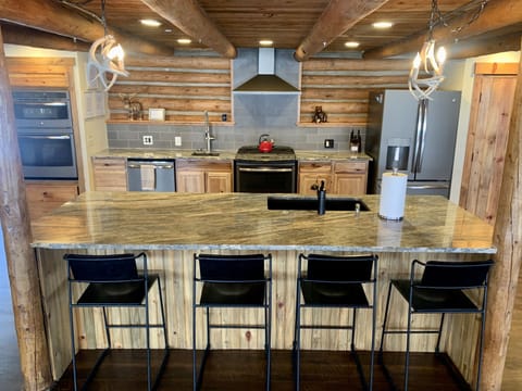 Updated kitchen with new double dishwashers, double sinks, 3 ovens, & gas stove.